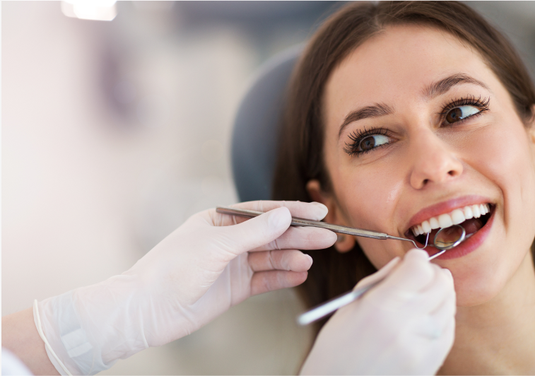 Beautiful Woman With Dentist Tools In Her Mouth