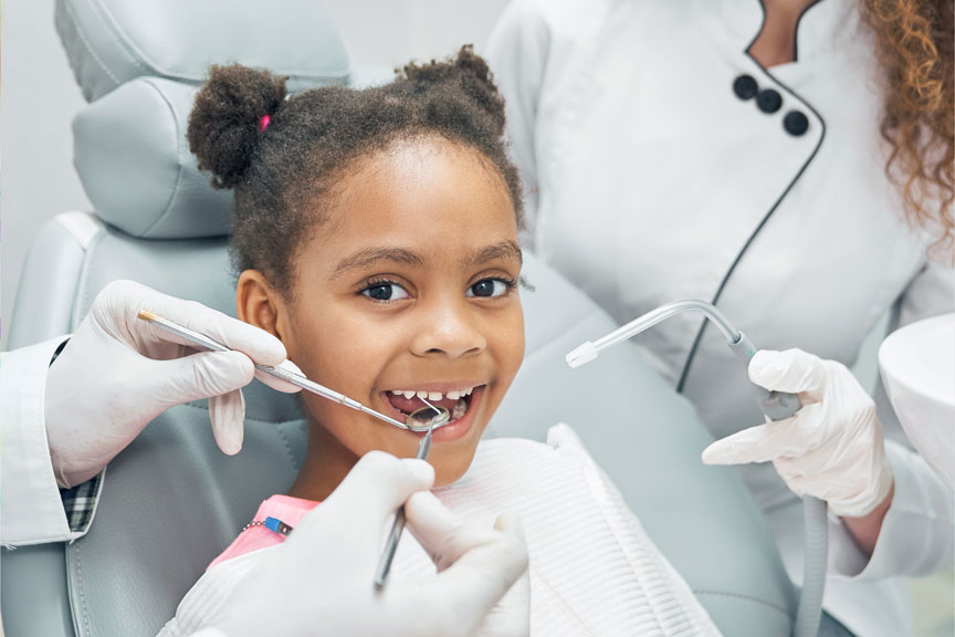 Young Girl Undergoing Dental Treatment